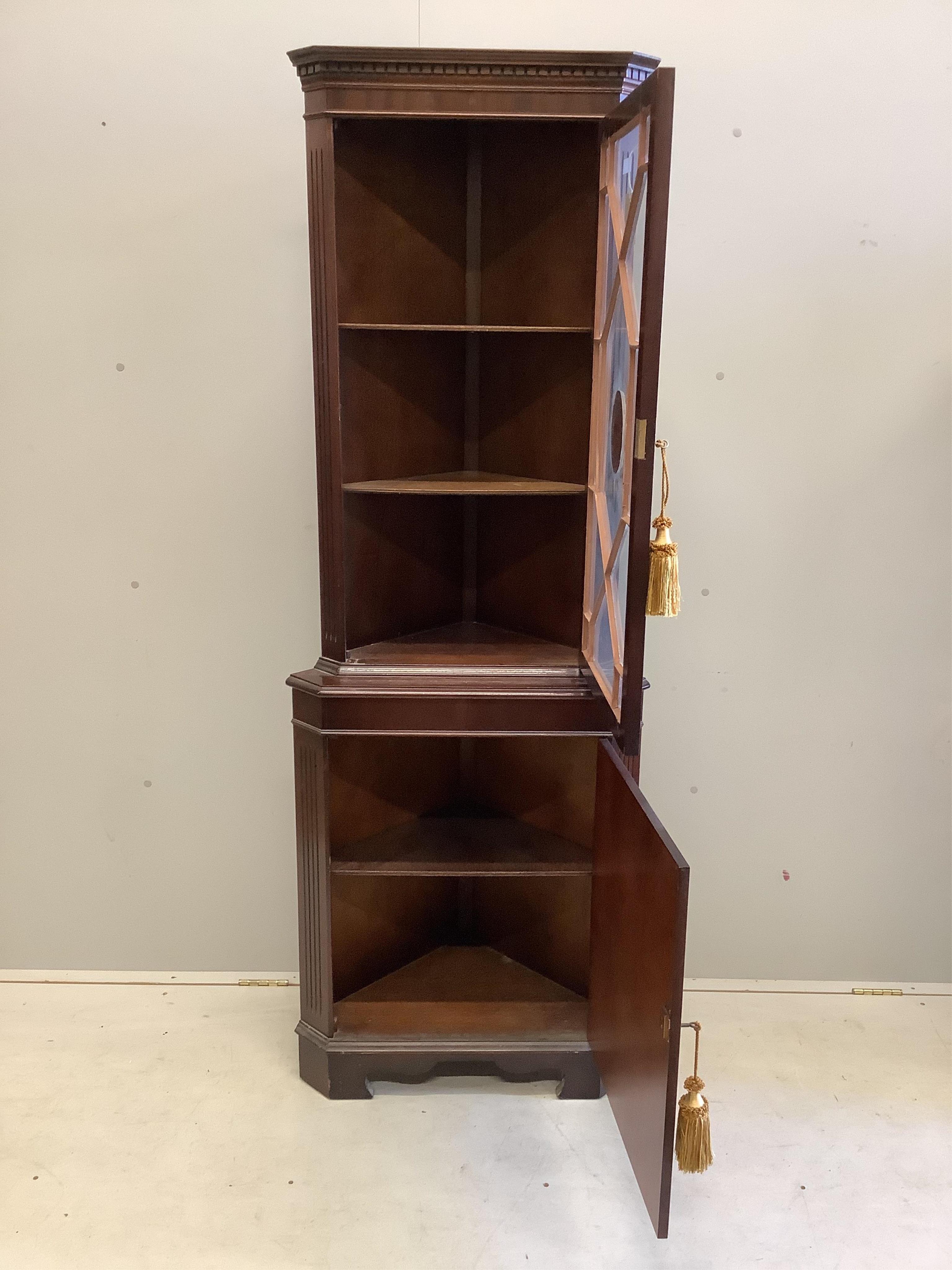 A suite of 20th century chinoiserie lacquer furniture comprising a standing corner cupboard, width 65cm, depth 40cm, height 182cm, a shaped oval centre table and four chairs